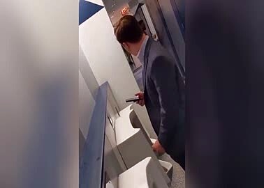 Hot guy in business suit at the urinal