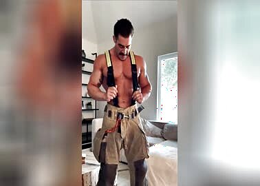 Muscle firefighter jerks his hose and cums