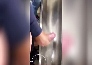 Handjob at the urinal