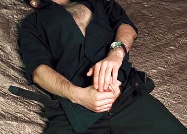 Young Handsome Man Noel Dero Masturbates on The Bed in A Beautiful Suit and Brings Himself to Orgasm